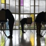 Voters mark their ballots at First Presbyterian Church on Election Day, Tuesday, Nov. 3, 2020, in Stamford, Conn. (AP)